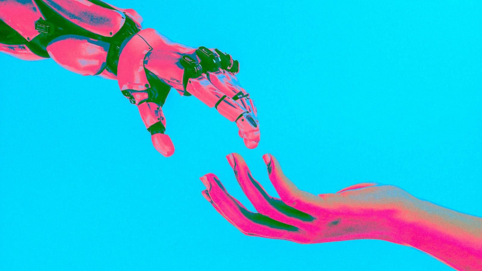 A robot hand and a human hand reaching toward each other on a turquoise background