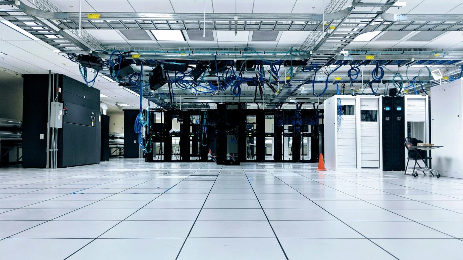 A bright data centre with rows of server cabinets